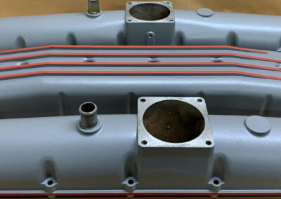 Cam cover in Steel Grey high-temperature ceramic with red highlights