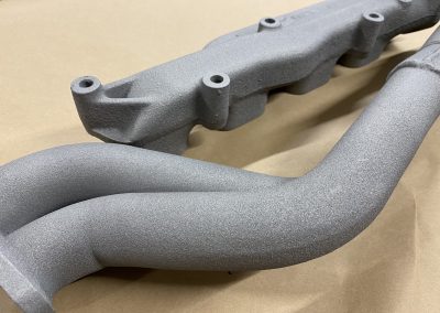 Manifold plasma coated in aluminium and finished in Cerakote titanium