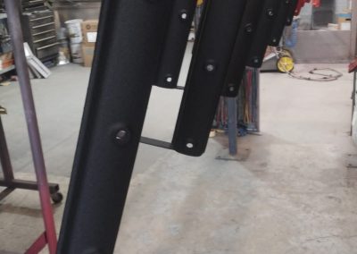Crinkle effect cam cover with high performance coating