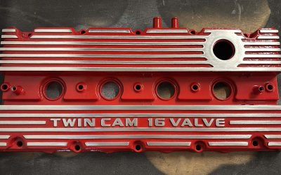 High performance coatings on crinkle effect cam covers