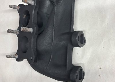 Exhaust manifold after plasma base coat and Cerakote satin black finish